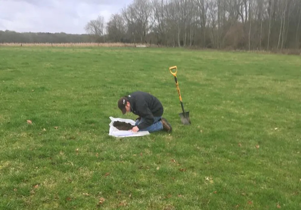 Anthony Ellis taking soil sample at South Downs National Park Authority
